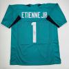 imageAutographedSigned Travis Etienne Jr Jacksonville Teal Football Jersey Beckett BAS COA