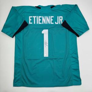 imageAutographedSigned Travis Etienne Jr Jacksonville Teal Football Jersey Beckett BAS COA