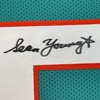 image:imageFramed AutographedSigned Sean Young 33x42 Ray Finkle Miami Teal Ace Ventura Movie Football Jersey PSADNA COA